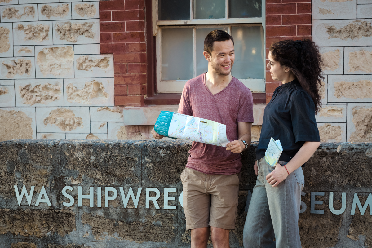 Two people looking at an active travel map